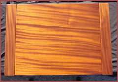 View of the beautiful and luminescent grain of the Mahogany top.